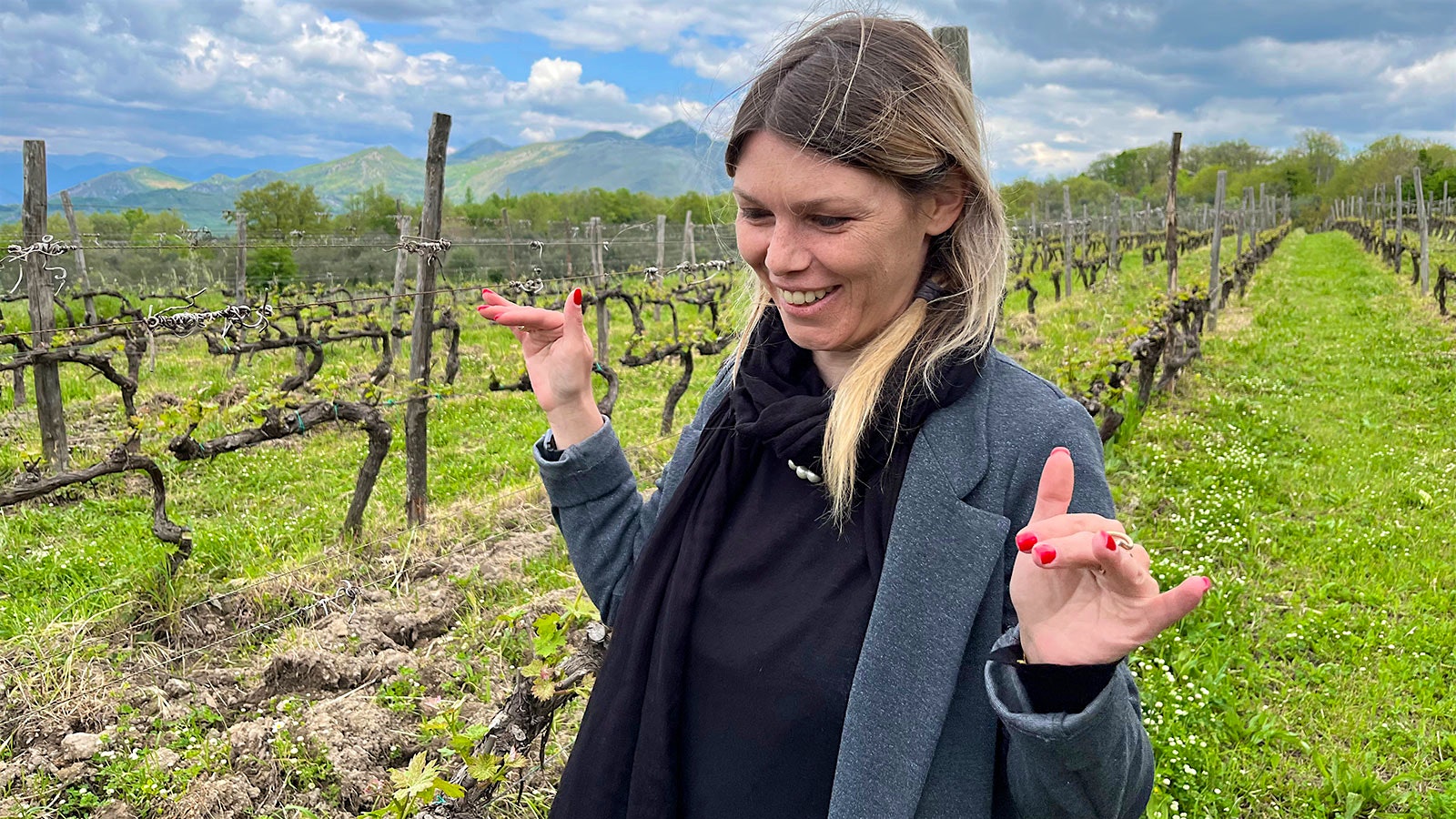 Portrait of Allegra Selvaggi smiling in one of Galardi's vineyards on the slopes of an extinct volcano